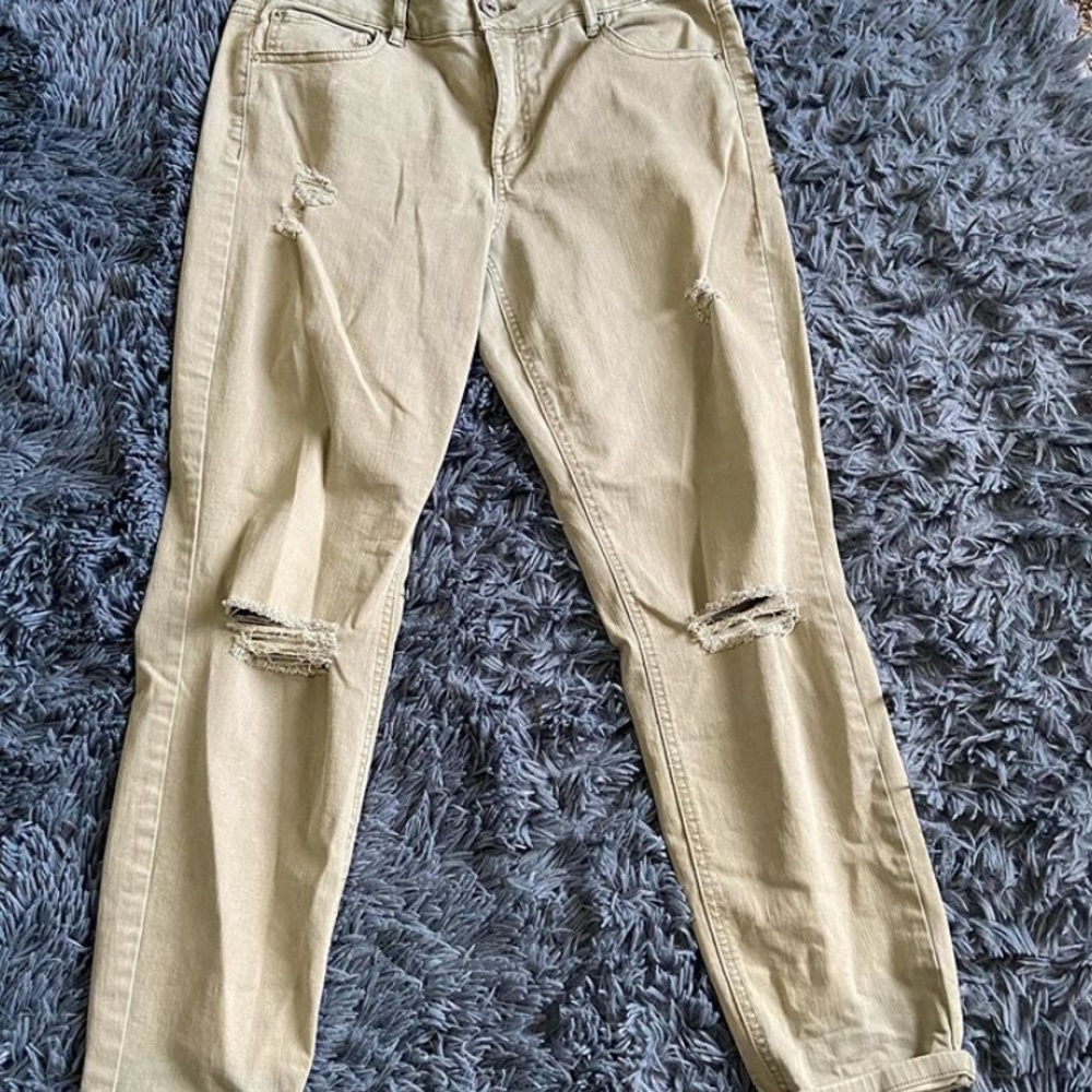 Faded green jeans